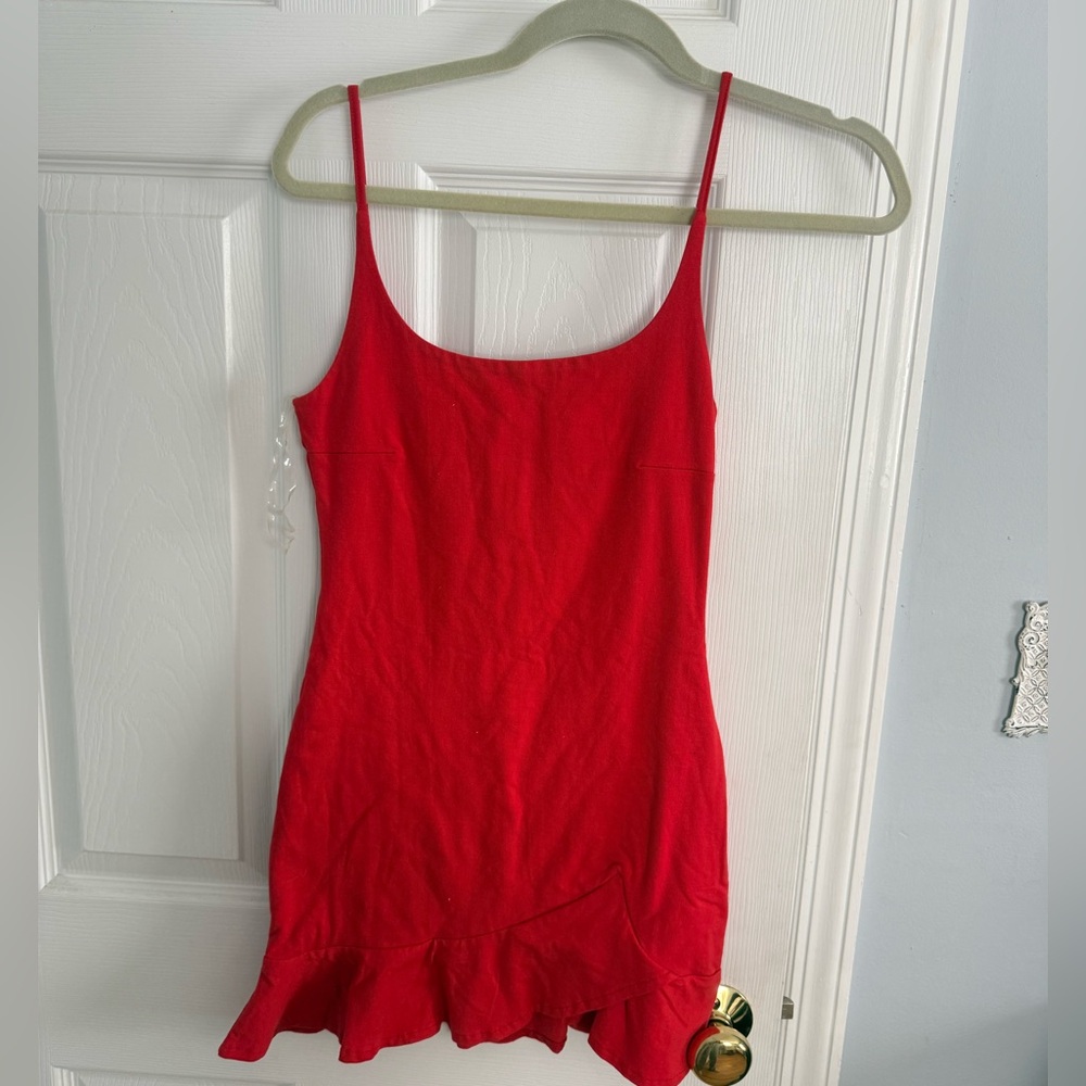 Meshki red mini dress with ruffle hem and adjustable straps. Size: S